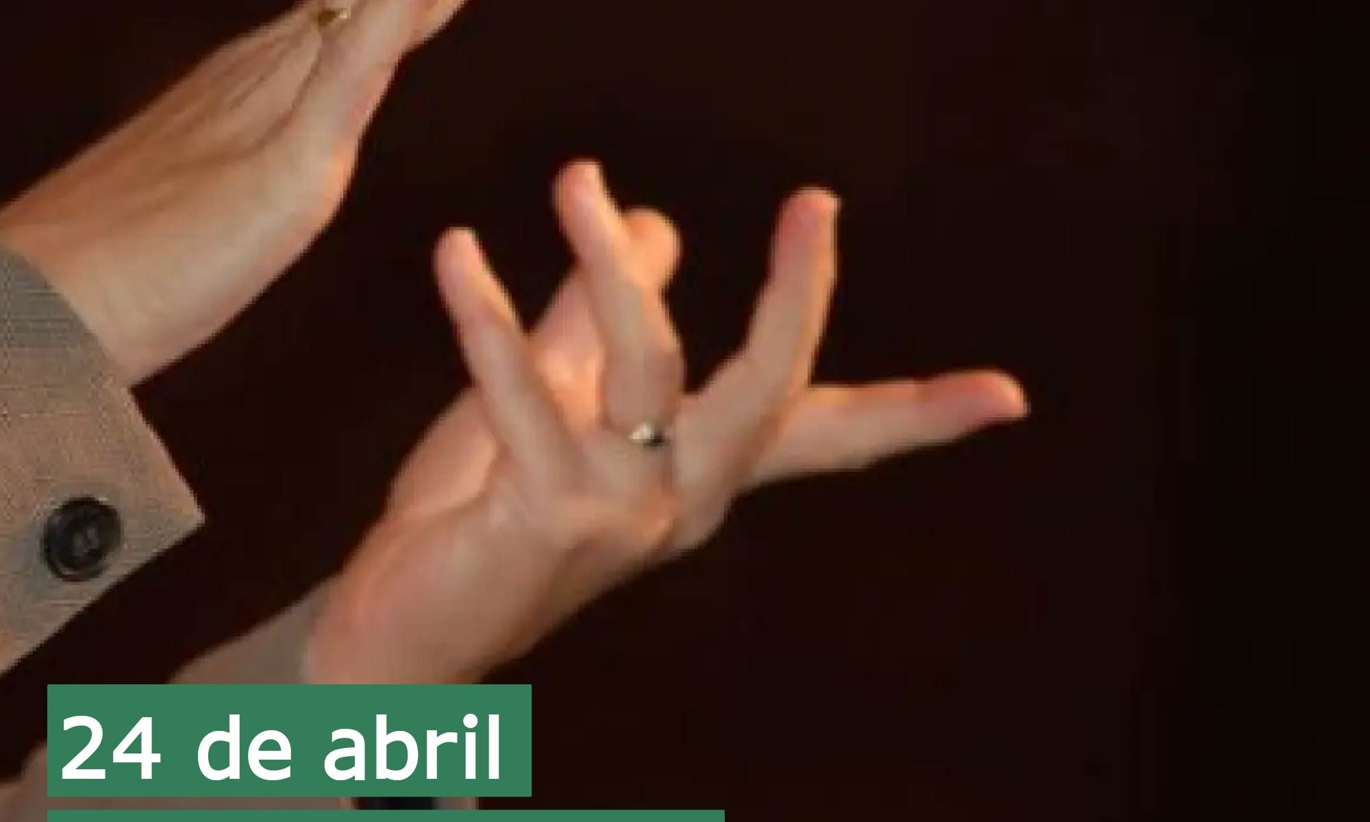 imagem de fundo escuro com duas mãos fazendo sinalização. Está escrito: "24 de abril Dia Nacional da Língua Brasileira de Sinais" e há a logo da Retina Brasil.